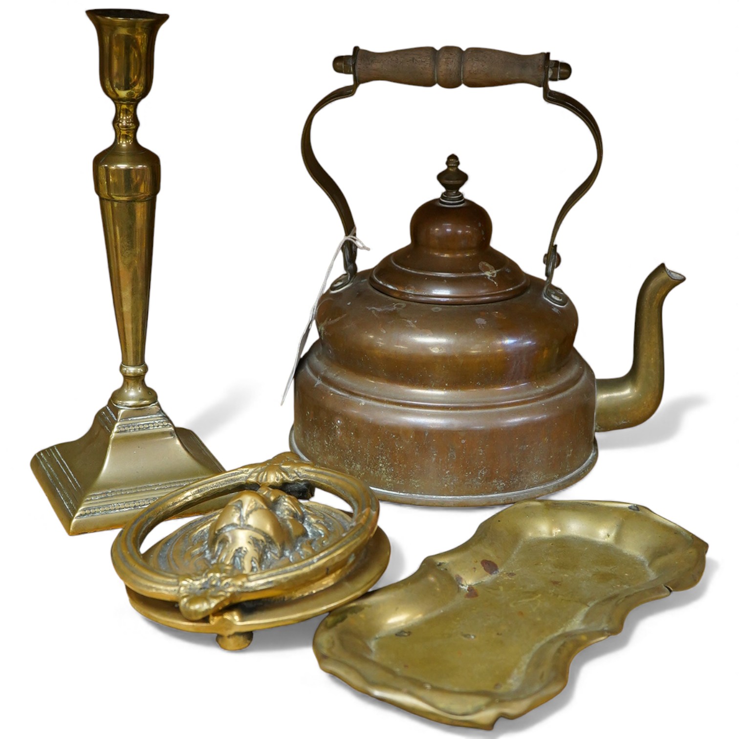 Four items of metalware comprising a candlestick, door knocker, tray and kettle, largest 26cm high